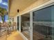 Ocean view from the bright and airy balcony with sliding glass doors to the living room at 6701 Gulf Of Mexico Dr # 311, Longboat Key, FL 34228
