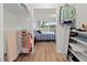 Walk-in closet leads to bedroom with bright windows offering a tranquil view at 6701 Gulf Of Mexico Dr # 311, Longboat Key, FL 34228