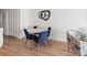 Bright dining area features a round table with seating for four and modern decor at 6701 Gulf Of Mexico Dr # 311, Longboat Key, FL 34228