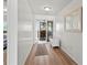 Bright condo entrance featuring wood floors and access to the rest of the living space at 6701 Gulf Of Mexico Dr # 311, Longboat Key, FL 34228