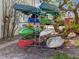 Various colorful kayaks and canoes neatly stored on a rack surrounded by trees and greenery at 6701 Gulf Of Mexico Dr # 311, Longboat Key, FL 34228