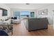 Bright and airy living room with ocean views and comfortable seating arrangements at 6701 Gulf Of Mexico Dr # 311, Longboat Key, FL 34228