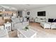 Spacious living room connected to kitchen and dining area, perfect for entertaining guests at 6701 Gulf Of Mexico Dr # 311, Longboat Key, FL 34228