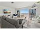 Bright living room with ocean views, comfortable seating, and access to a private balcony at 6701 Gulf Of Mexico Dr # 311, Longboat Key, FL 34228