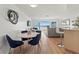 Open living space with dining area, bar seating, ocean views, and sliding glass doors at 6701 Gulf Of Mexico Dr # 311, Longboat Key, FL 34228