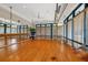 Bright fitness studio with hardwood floors, mirrors, and natural light at 6922 Stanhope Pl, University Park, FL 34201