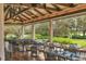 Outdoor seating area featuring tables, chairs, and a view of the water at 6922 Stanhope Pl, University Park, FL 34201