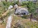 Aerial view of house with garage and guest house in a landscaped yard at 7415 36Th E Ave, Palmetto, FL 34221