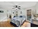 Bedroom featuring hardwood floors, windows with blinds, and coastal decor at 7415 36Th E Ave, Palmetto, FL 34221