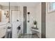 This bathroom features a tiled shower with gray and white accents and built-in shelving at 7415 36Th E Ave, Palmetto, FL 34221