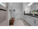 Bathroom featuring dual sinks, modern cabinets, and walk-in shower at 8541 Coastal Palms Gln, Parrish, FL 34219