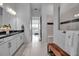 Bright and airy bathroom with double vanity, granite countertop, and walk-in shower with glass enclosure at 8541 Coastal Palms Gln, Parrish, FL 34219