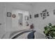 Bright hallway with an accent rug, white walls, and views into multiple rooms at 8541 Coastal Palms Gln, Parrish, FL 34219