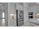 Stainless steel refrigerator and kitchen appliances in a bright kitchen at 8541 Coastal Palms Gln, Parrish, FL 34219