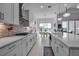 Open kitchen with stainless steel appliances and eat-in dining area at 8541 Coastal Palms Gln, Parrish, FL 34219