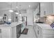 Bright kitchen with stainless steel appliances and large center island at 8541 Coastal Palms Gln, Parrish, FL 34219