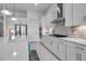 Kitchen with stainless steel appliances, undermount lighting, and tiled backsplash at 8541 Coastal Palms Gln, Parrish, FL 34219