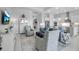 Open-concept living area featuring modern furnishings and decor, seamlessly connected to the adjacent kitchen area at 8541 Coastal Palms Gln, Parrish, FL 34219