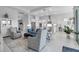 Open-concept living area featuring modern furnishings and decor, seamlessly connected to the adjacent kitchen area at 8541 Coastal Palms Gln, Parrish, FL 34219