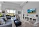 Bright living room showcasing comfortable furniture, decor, and a seamless indoor-outdoor flow at 8541 Coastal Palms Gln, Parrish, FL 34219