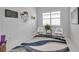 Inviting home office featuring white walls, plantation shutters, accent decor, and a stylish rug at 8541 Coastal Palms Gln, Parrish, FL 34219