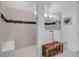 Modern shower with glass partition, bench, and tile accents at 8541 Coastal Palms Gln, Parrish, FL 34219