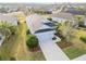 Aerial shot of a gray single-story house with manicured lawn and landscaped surroundings at 11231 Woodlake Way, Parrish, FL 34219
