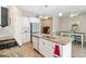 Well-equipped kitchen with stainless steel appliances, granite countertops, and a functional island sink at 11231 Woodlake Way, Parrish, FL 34219