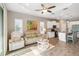 Open living space connecting living room to the kitchen with a view of modern appliances and granite countertops at 11231 Woodlake Way, Parrish, FL 34219
