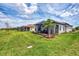 Expansive backyard featuring a screened lanai and lush landscaping, perfect for outdoor activities at 16119 Fortezza Dr, Bradenton, FL 34211