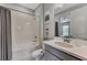 Bright bathroom featuring a shower-tub combo and modern vanity with neutral paint scheme at 16119 Fortezza Dr, Bradenton, FL 34211