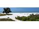 Expansive beach with white sand and clear blue water, ideal for enjoying a sunny day at 16119 Fortezza Dr, Bradenton, FL 34211
