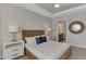 Serene bedroom featuring bedside tables, lamps, a comfortable bed, and a connected bathroom with modern fixtures at 16119 Fortezza Dr, Bradenton, FL 34211