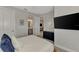 Comfortable bedroom with a flat screen TV, an ensuite bathroom, dresser, and decorative touches at 16119 Fortezza Dr, Bradenton, FL 34211