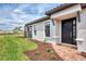 Single Gathering home with a paver walkway and lush landscaping leading to the front door at 16119 Fortezza Dr, Bradenton, FL 34211