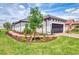 Single Gathering home with a two car garage, paver driveway, green grass and professionally landscaped front yard at 16119 Fortezza Dr, Bradenton, FL 34211