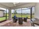 Inviting screened lanai featuring comfortable seating and outdoor grill, perfect for entertaining at 16119 Fortezza Dr, Bradenton, FL 34211