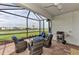 Relaxing screened lanai with comfortable seating and picturesque water view at 16119 Fortezza Dr, Bradenton, FL 34211