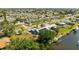 Wide aerial view of a waterfront neighborhood with manicured lawns and various home styles at 198 Salem Nw Ave, Port Charlotte, FL 33952