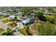 Aerial view featuring a well-situated canal home with solar panels, private boat lift, and a spacious backyard lanai at 198 Salem Nw Ave, Port Charlotte, FL 33952