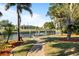 Inviting backyard featuring a private dock, lush landscaping, and canal views at 198 Salem Nw Ave, Port Charlotte, FL 33952