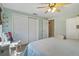 Serene bedroom with hardwood floors, ceiling fan, and a closet for ample storage at 198 Salem Nw Ave, Port Charlotte, FL 33952