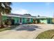 This cozy single-story home features a well-manicured lawn and a clean driveway leading to the garage at 198 Salem Nw Ave, Port Charlotte, FL 33952