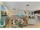 Open living room with tile flooring, comfortable seating, and access to outdoor space, perfect for relaxing at 198 Salem Nw Ave, Port Charlotte, FL 33952