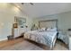 Comfortable main bedroom featuring light walls, light wood-look floors, and ample natural light at 198 Salem Nw Ave, Port Charlotte, FL 33952