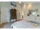Bright bedroom featuring light-colored walls, light wood-look floors, and elegant decor at 198 Salem Nw Ave, Port Charlotte, FL 33952
