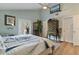 Bedroom showcases light-colored walls, light wood-look floors, and glass door access to the outdoors at 198 Salem Nw Ave, Port Charlotte, FL 33952
