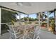 Relaxing outdoor dining area with tropical floral tablecloth and beautiful views at 198 Salem Nw Ave, Port Charlotte, FL 33952
