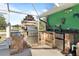 Well-equipped outdoor kitchen with stone accents, grill, sink, and mini-fridge at 198 Salem Nw Ave, Port Charlotte, FL 33952