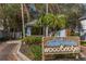Woodbridge community entrance sign with lush landscaping in a serene setting at 2630 Moss Oak Dr # 50, Sarasota, FL 34231